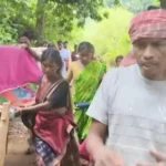 Pregnant Woman Carried on Cot